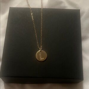 “L” initial charm gold necklace.
